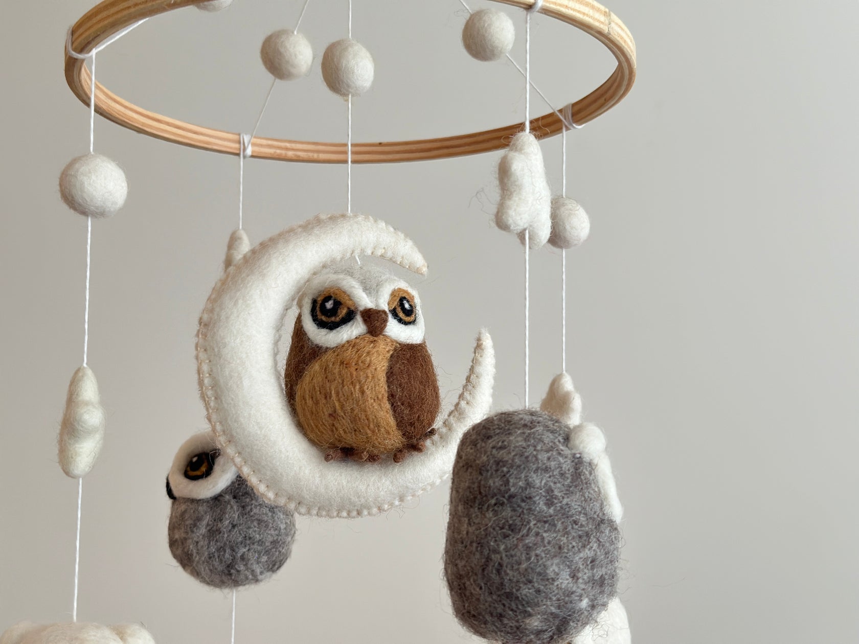 Mobile - Felt Baby - Owl showing a soft felt owl perched on a crescent moon, surrounded by neutral-hued felt balls and shapes, perfect for a stylish children's boutique nursery.