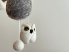 Close-up of wool felt owl hanging from a baby mobile in soft neutral tones, part of Mobile - Felt Baby - Owl from a curated children’s boutique focused on cozy baby accessories.