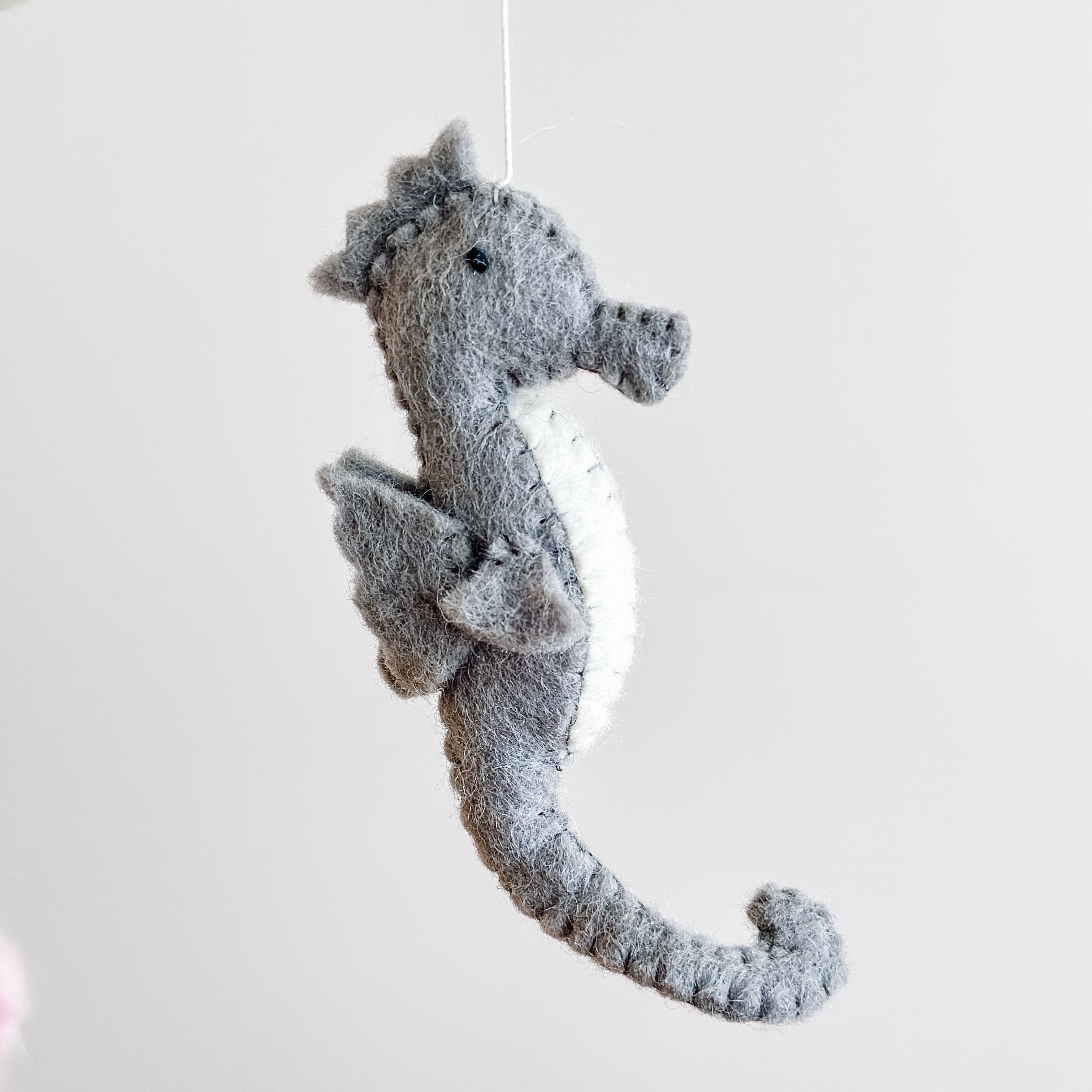 Mobile - Felt Baby - Sea Life soft gray felt seahorse hanging decoration, handcrafted with stitched detailing, perfect for a curated children’s boutique and stylish nursery décor.