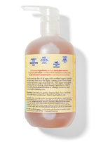 Back view of a bottle of California Baby - Calendula™ Shampoo & Bodywash showing label details about its gentle, plant-based formula designed for sensitive skin with certified organic calendula and soothing essential oils.