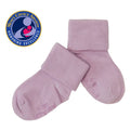 Pair of soft lavender baby socks with fold-over cuffs and grip soles, babysoy Inc - Babysoy Modern Stay on Socks: Lavender, displayed alongside a Mom’s Choice Awards badge.