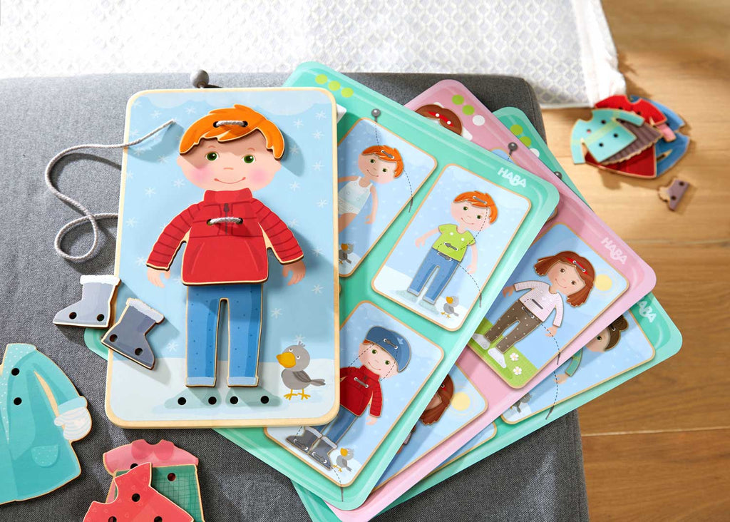 Dress Me Threading & Lacing Game featuring wooden characters and clothing pieces designed for imaginative play and fine motor skills development in children.