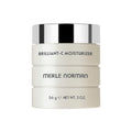 Brilliant-C Moisturizer in a sleek cream-colored jar with a shiny silver lid, highlighting a luxurious skincare essential for mom life essentials.
