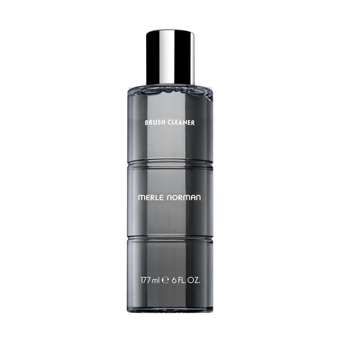 Brush Cleaner in a sleek, translucent dark bottle with a silver cap, designed for easy and effective makeup brush cleaning.