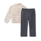 Children's outfit with striped shirt and dark pants on a white background