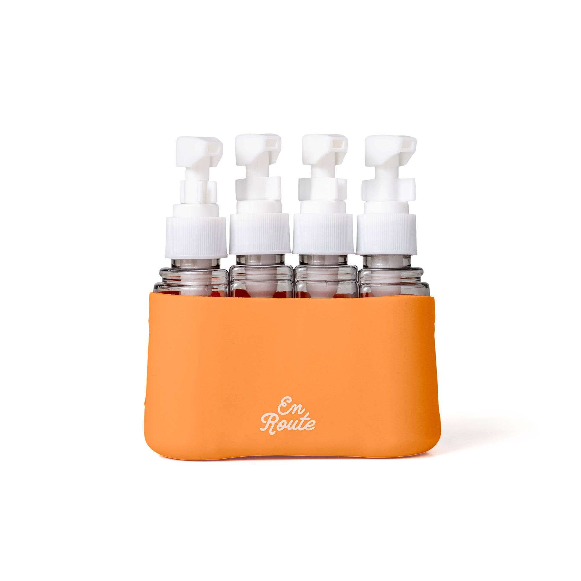 En Route - Bon Voyage 4 Piece Travel Bottles featuring four clear travel-sized bottles with white caps in an orange silicone holder, perfect for stylish kids and mom life essentials.