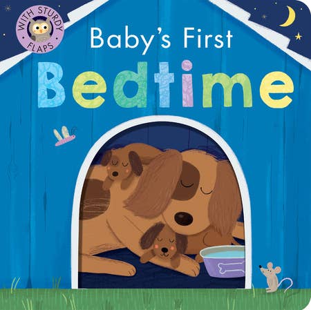 Cover of Baby's First Bedtime Board Book featuring a colorful title and an illustration of a dog and puppy sleeping inside a blue doghouse under a moonlit sky, with sturdy flaps for interactive play.
