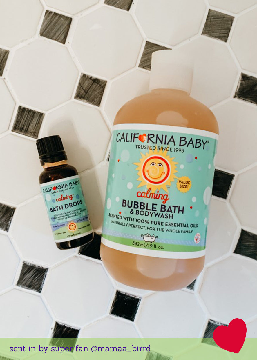 California Baby - Calming™ Bubble Bath & Bodywash bottle on a white tile surface, paired with calming bath drops for a soothing bath experience in a curated children’s boutique setting.