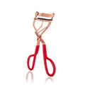 Almost Famous - Chrome 'No Pinch' Eyelash Curler: Red / Rose Gold with ergonomic red handles and rose gold metal frame designed for comfortable and precise eyelash curling.