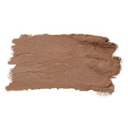 Smooth swatch of bronzer shade in warm brown tones highlighting the creamy texture of the Cheek Crayon (Limited-Edition) from a curated children’s boutique with mom life essentials.