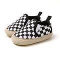 Urban Tots - Casual Slip Ons - Checkered featuring a black and white checkered pattern with a woven natural fiber sole, designed for stylish kids with comfort and easy slip-on fit.