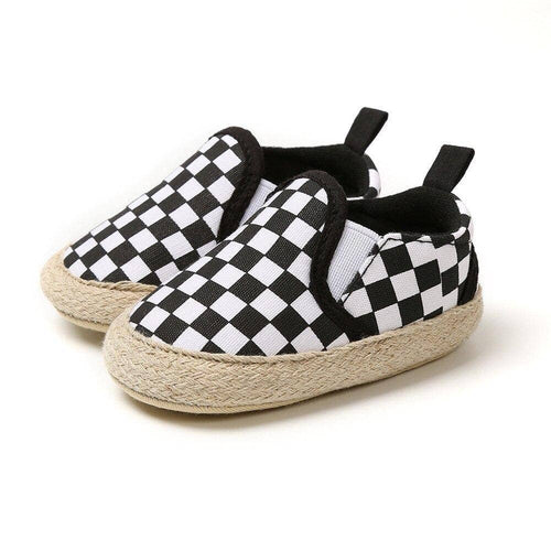 Urban Tots - Casual Slip Ons - Checkered featuring a black and white checkered pattern with a woven natural fiber sole, designed for stylish kids with comfort and easy slip-on fit.