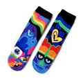 Colorful mismatched kid socks featuring playful abstract faces and vibrant patterns in blue, green, orange, and black, designed as Pals Socks - Silly & Serious Mismatched Non-Slip Kid Socks (Limited Edition).