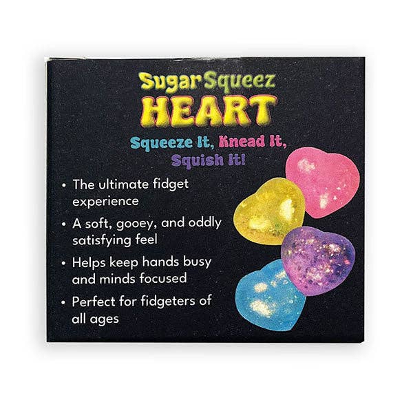 A square product box for 'Sugar Squeeze Heart' fidget toys on a white background. The box is black with colorful text and shows four heart-shaped fidgets in pink, yellow, purple, and blue with glitter.
