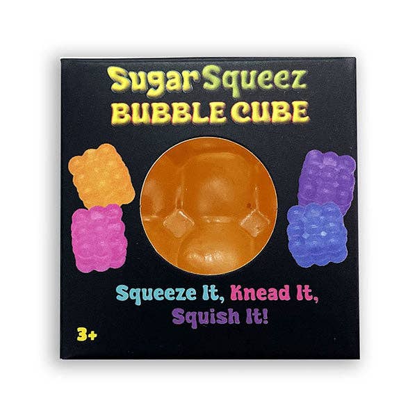 Sugar Squeez Bubble Cube product packaging on a white background. The black square box features a circular cutout showing the translucent orange-brown bubble cube inside, with colorful illustrations of squeeze gummy bears on each side and playful text.
