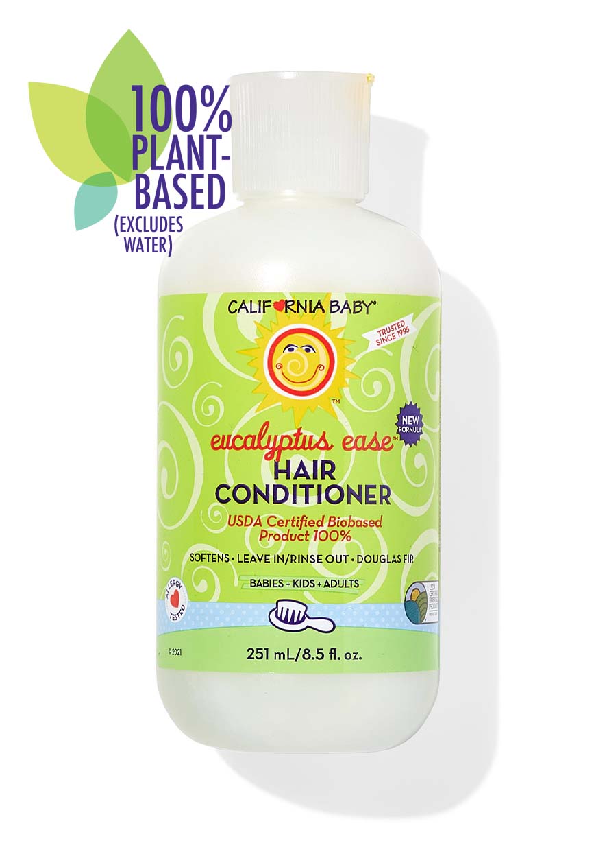 Bottle of California Baby - Eucalyptus Ease™ Hair Conditioner with light green label featuring a smiling sun logo, highlighting 100% plant-based ingredients and suitability for babies, kids, and adults.