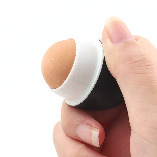 Hand holding BeNat - Volcanic Stone Oil-Absorbing Face Roller with smooth, natural volcanic stone tip against a white background, showcasing the skincare tool’s compact design.