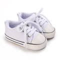 Urban Tots - Urban Sneaks - White toddler shoes with soft fabric, sturdy laces, and a flexible sole, perfect for stylish kids and everyday comfort in a curated children’s boutique.