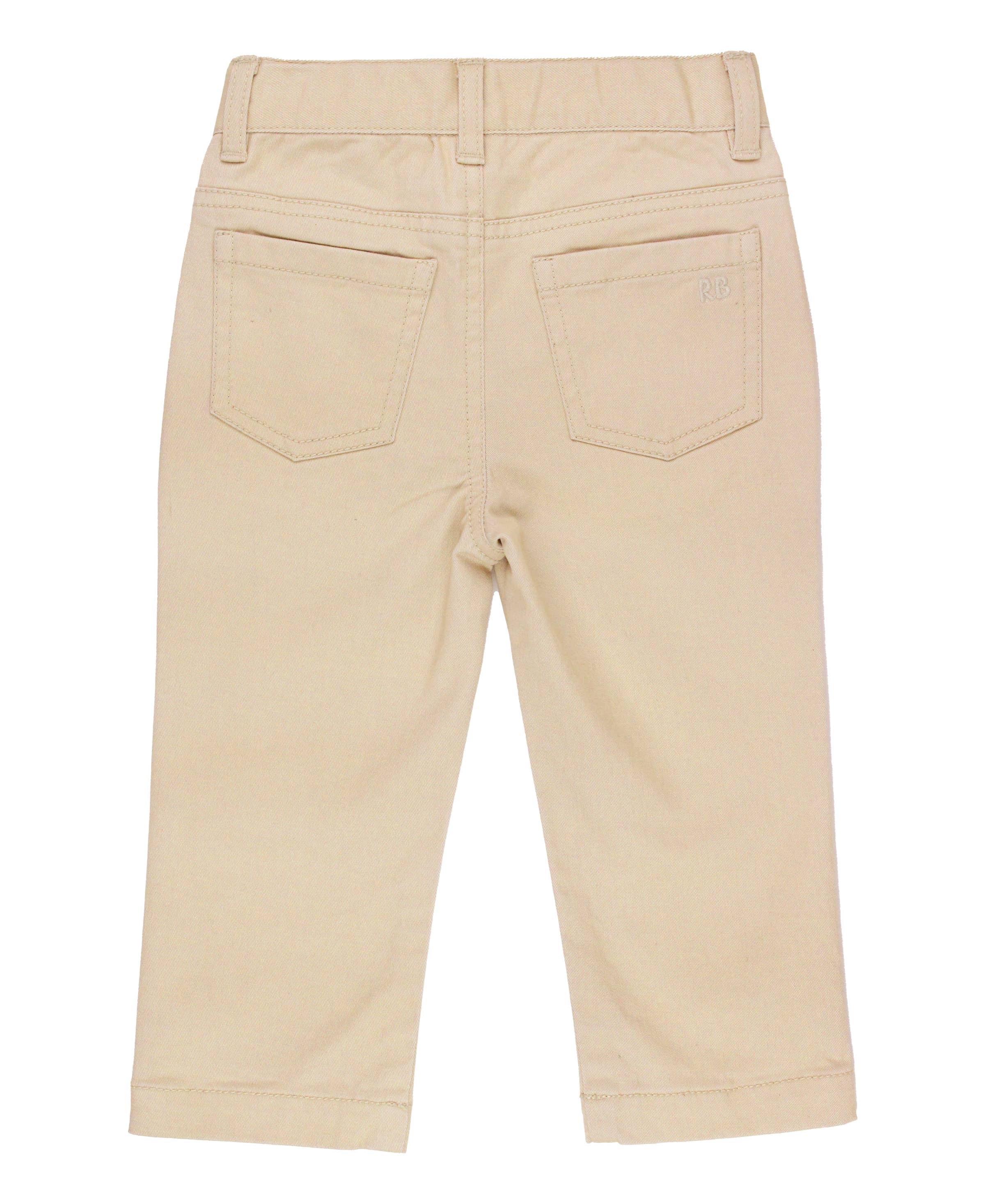Back view of RuffleButts + RuggedButts - Boys Khaki Stretch Chino Pants: Off-White, showcasing soft neutral fabric and durable stitching for stylish kids clothing in a curated children’s boutique.