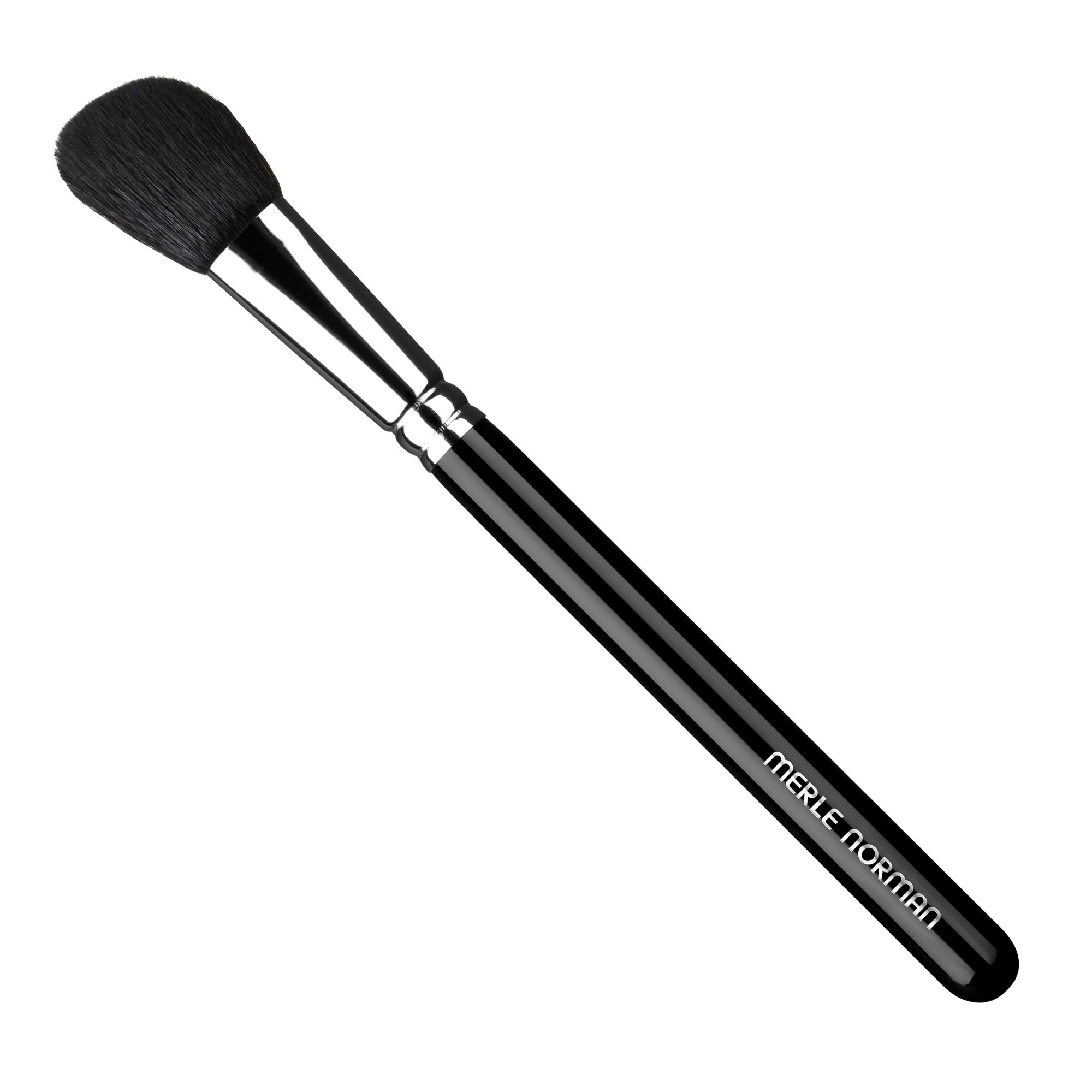 Merle Norman Cosmetics - Makeup Artistry Face #5 Brush (Angled Blush) with soft black bristles and sleek black handle, ideal for precise blush application in a stylish design.