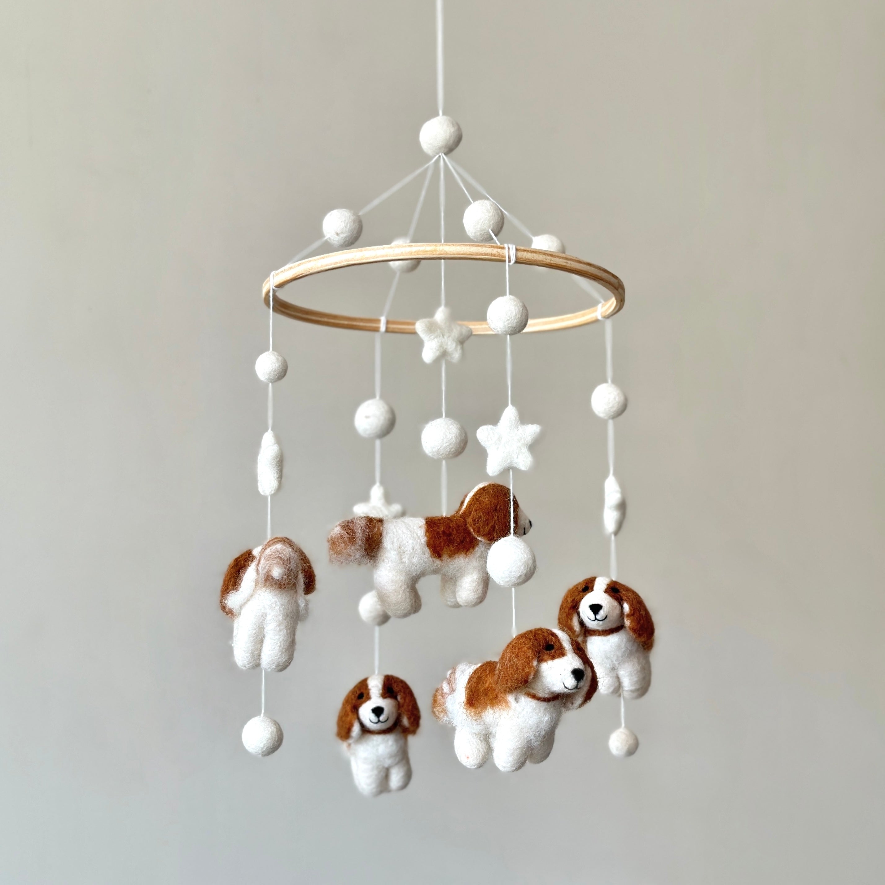 Mobile - Felt Baby - Cavalier King Charles Cavalier hanging baby mobile featuring soft felt dogs and stars in neutral tones, a stylish and cozy baby accessory from curated children’s boutique.