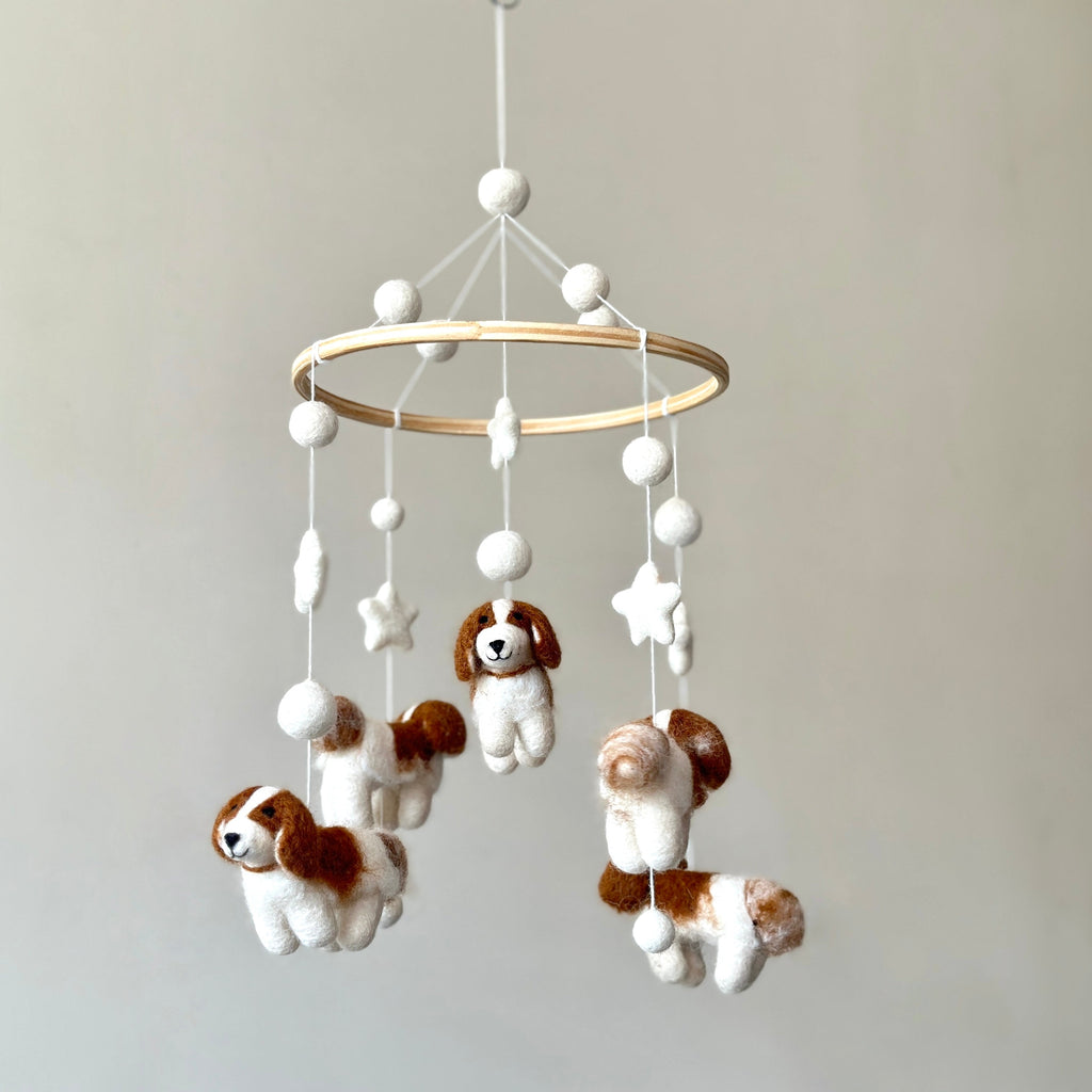 Mobile - Felt Baby - Cavalier King Charles Cavalier features soft felt dog and star shapes hanging from a wooden hoop, creating a cozy and stylish baby accessory perfect for a children’s boutique.