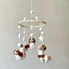 Mobile - Felt Baby - Cavalier King Charles Cavalier features soft felt dog and star shapes hanging from a wooden hoop, creating a cozy and stylish baby accessory perfect for a children’s boutique.