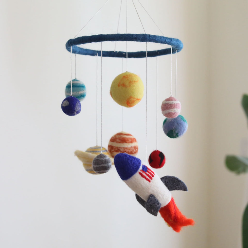 Mobile - Felt Baby - Solar System featuring colorful felt planets and a rocket hanging from a blue ring, perfect for nursery decor in a curated children’s boutique.
