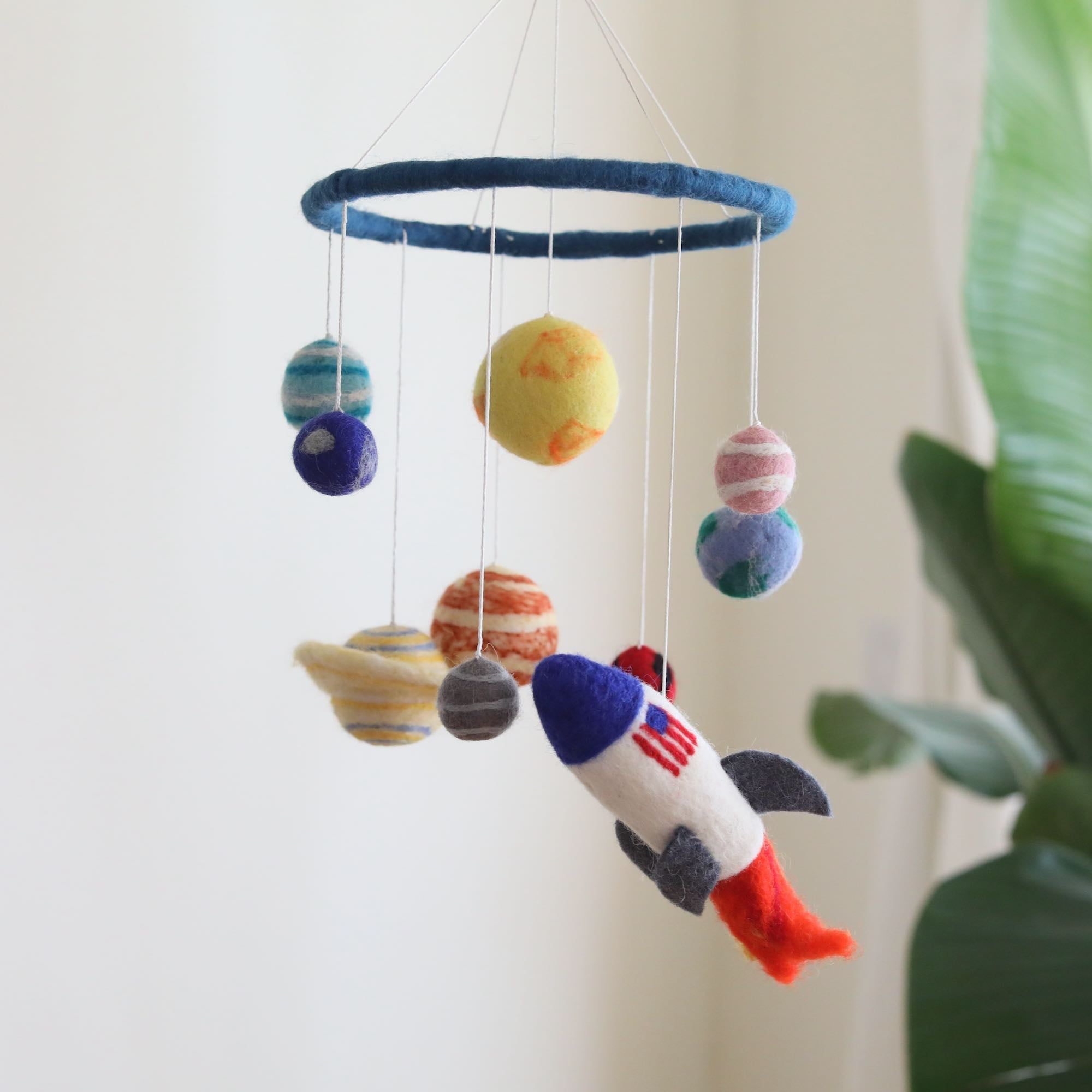 Mobile - Felt Baby - Solar System featuring soft felt planets and a rocket, designed as a cozy, educational baby accessory for stylish kids and mom life essentials.