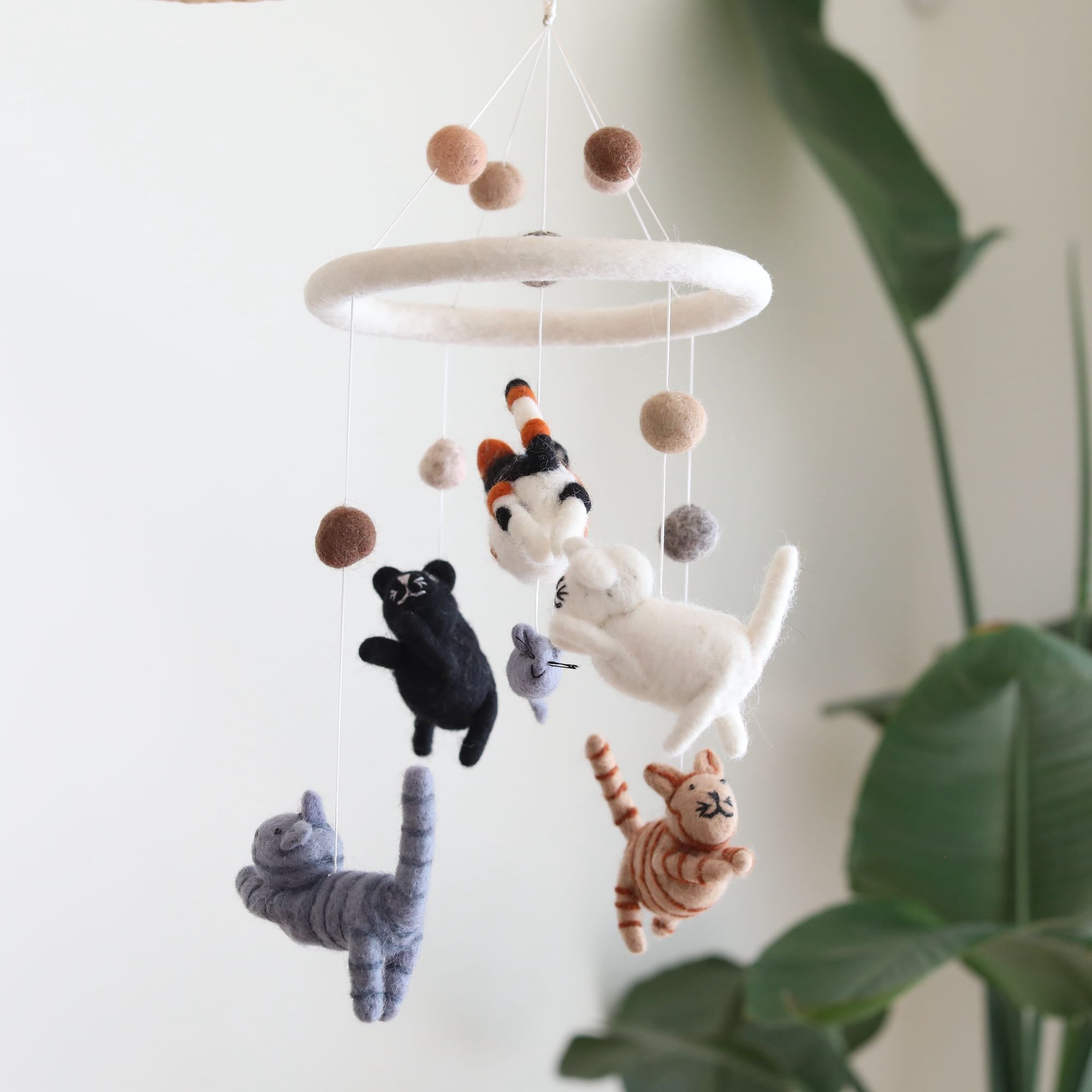 Mobile - Felt Baby - Cat featuring five soft felt cats in neutral tones hanging from a circular frame, perfect for a modern baby boutique or curated children’s boutique setting.