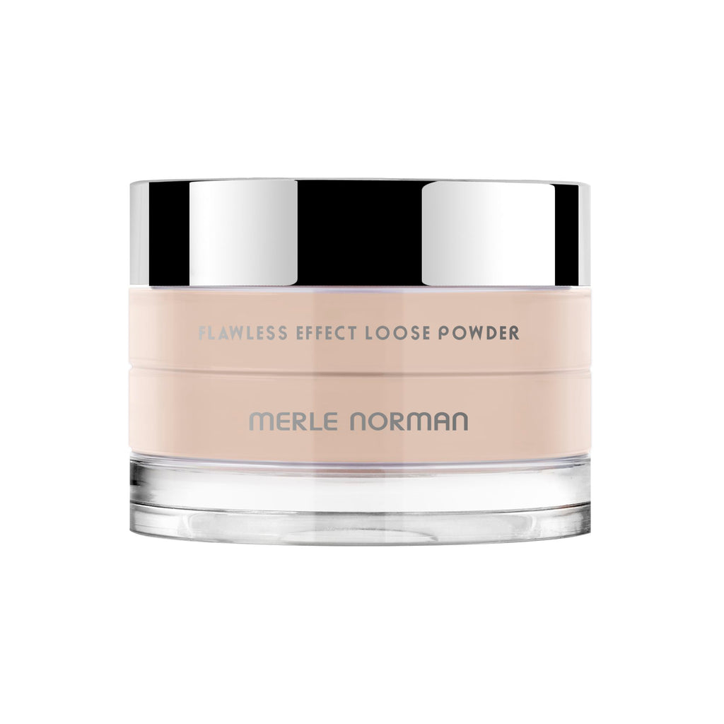 Merle Norman Cosmetics - Flawless Effect Loose Powder in a light, neutral tone with a sleek, clear container and reflective silver lid, ideal for a natural makeup finish.