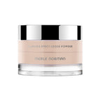 Merle Norman Cosmetics - Flawless Effect Loose Powder in a light, neutral tone with a sleek, clear container and reflective silver lid, ideal for a natural makeup finish.