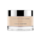 Merle Norman Cosmetics - Flawless Effect Loose Powder in a light neutral shade with a clear bottom jar and reflective silver lid, designed for a smooth, natural finish.