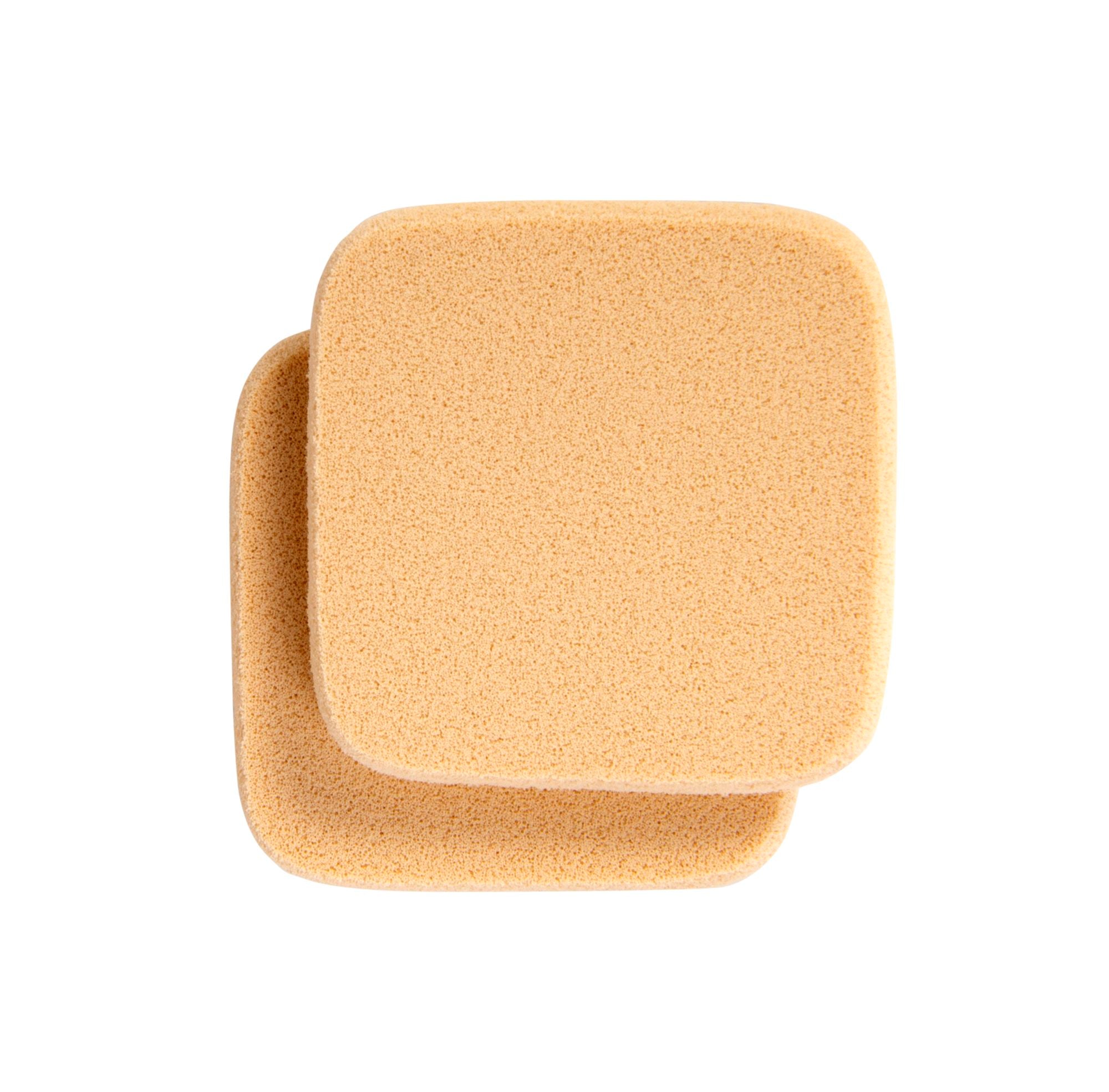 Two beige square makeup sponges designed for smooth foundation application, Merle Norman Cosmetics - Foundation Sponges, ideal for mom life essentials and stylish kids clothing care.