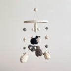 Mobile - Felt Baby Gray Sheep featuring soft felt sheep and star shapes in neutral tones, perfect for adding cozy charm to a nursery in a curated children’s boutique.