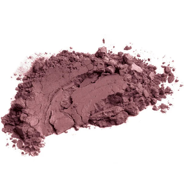 Close-up of softly textured muted rose pink powder blush, showcasing a rich, blendable pigment from Merle Norman Cosmetics - Lasting Cheekcolor.
