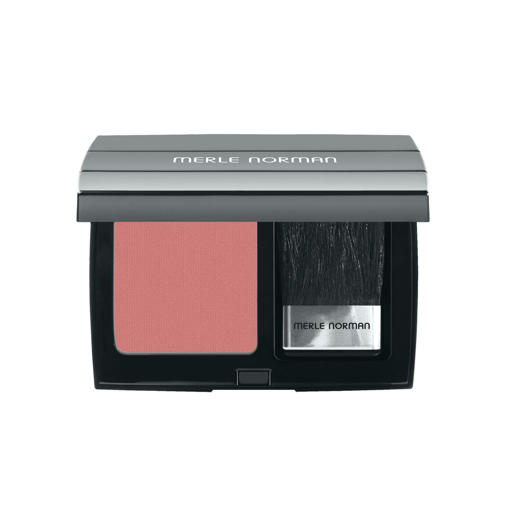 Compact makeup case with rosy mauve blush and an applicator brush, designed for a natural, lasting finish with Merle Norman Cosmetics - Lasting Cheekcolor.