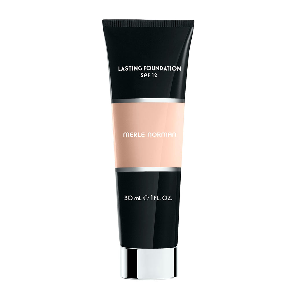 Tube of Merle Norman Cosmetics - Lasting Foundation SPF 12 in a neutral alabaster shade, featuring sleek black and beige packaging ideal for a curated children’s boutique focused on mom life essentials.