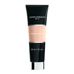 Tube of Merle Norman Cosmetics - Lasting Foundation SPF 12 in a neutral alabaster shade, featuring sleek black and beige packaging ideal for a curated children’s boutique focused on mom life essentials.