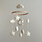 Mobile - Felt Baby - Moon & Stars hanging nursery decor with soft wool felt clouds, stars, and crescent moon in neutral tones, perfect for a cozy baby boutique setting.