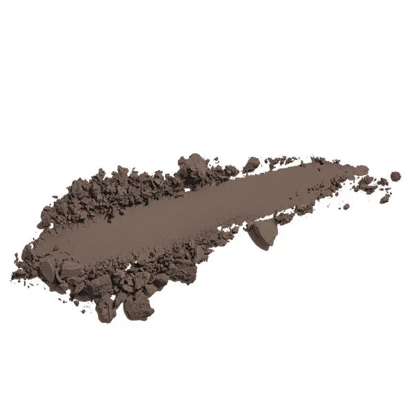 Swatch of Merle Norman Cosmetics - Natural Brow Powder in a rich chestnut brown shade, showcasing smooth, blendable texture for natural-looking brows.