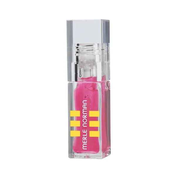 Clear rectangular container with bright pink natural lip oil inside, featuring Merle Norman branding, showcasing the Natural Lip Oil (Limited-Edition) for mom life essentials.