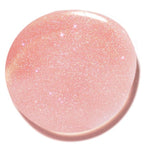 Close-up of a soft pink shimmering swatch of Natural Lip Oil (Limited-Edition) showcasing its smooth, glossy texture and delicate sparkle, perfect for mom life essentials.
