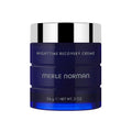 Nighttime Recovery Creme in a sleek deep blue jar with silver lid, designed for mom life essentials and stylish skincare routines.