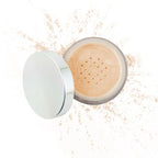 Purely Mineral Makeup loose powder foundation in a light natural shade, with a sleek silver lid and soft powder texture around the container.