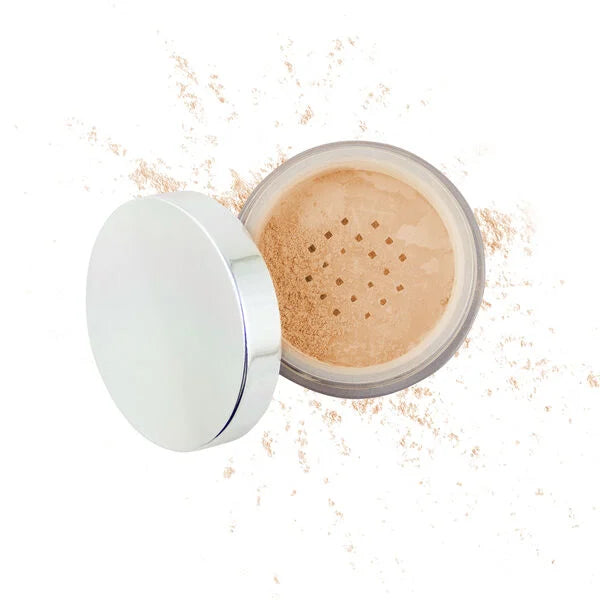 Open jar of loose mineral makeup powder with a silver lid and scattered powder around, showcasing Purely Mineral Makeup.