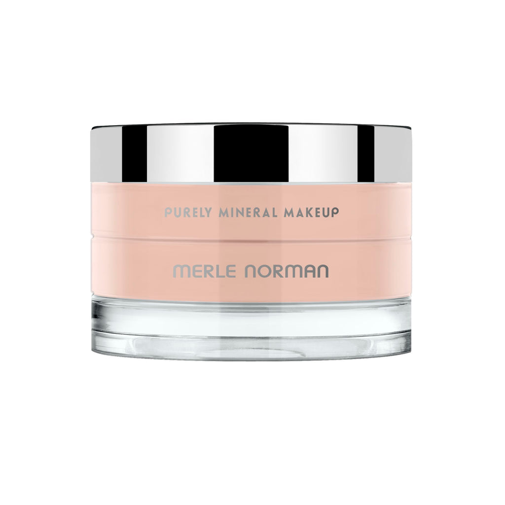 Jar of Purely Mineral Makeup in soft peach tone with reflective silver lid, showcasing smooth mineral foundation suitable for a natural look.