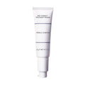 White tube of Red Correct Treatment Primer with minimalist navy text and cap, designed for color correction and smooth skin application.