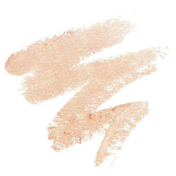 Soft peachy shimmer swatches from Shadow Stick, showcasing a glowing neutral shade with smooth, blendable texture.