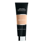 Merle Norman Cosmetics - Sheer Defense Tinted Moisturizer SPF 15 in a sleek black and beige tube, offering lightweight, broad spectrum sun protection and a natural look.